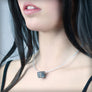 Necklace with small black cube