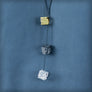 Necklace with 3 small tricolour cubes