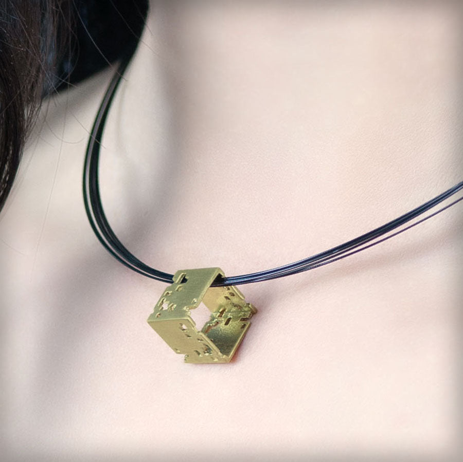 Necklace with small golden cube