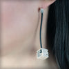 Pendientes cubo colgante de plata, colección Cub · Nerea Aixàs