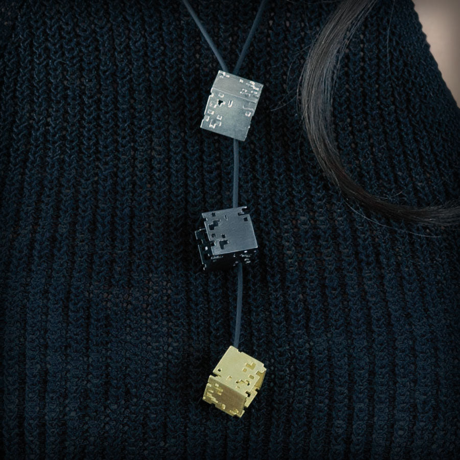 Necklace with 3 tricolour cubes
