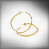 Medium hoop earrings in gold-plated silver, Rastres collection · Nerea Aixàs