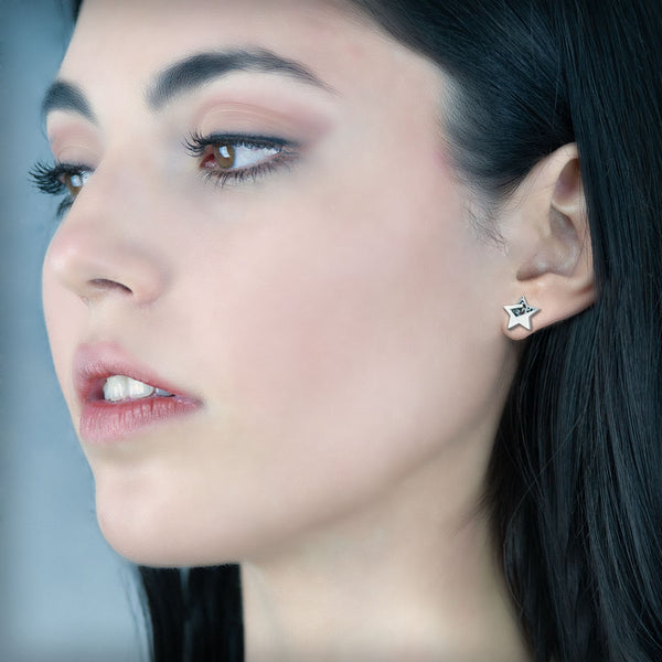 Pendientes botón estrella de plata, colección Estrella · Nerea Aixàs